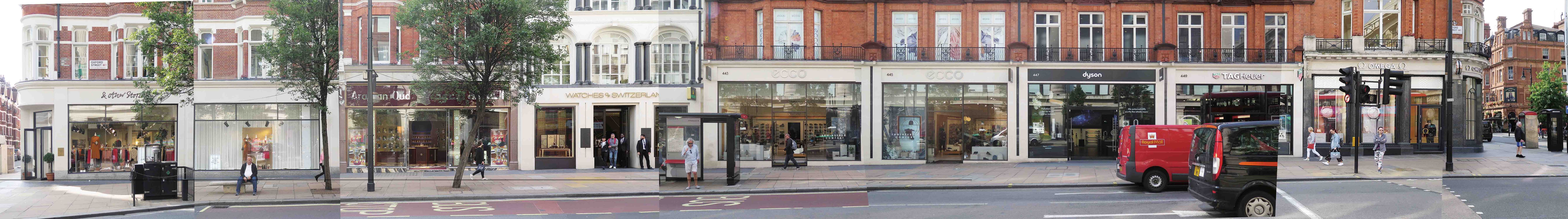 Panoramic photo of a strip of oxford street with a number of shops