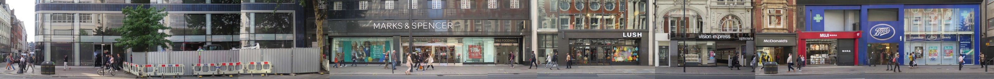 Panoramic photo of a strip of oxford street with a number of shops