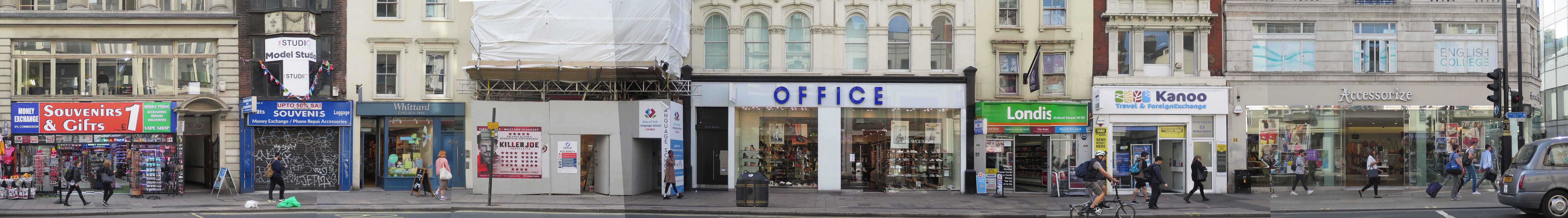 Panoramic photo of a strip of oxford street with a number of shops