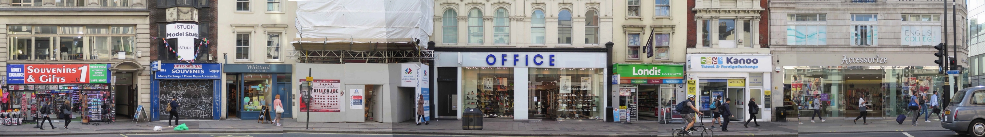 Panoramic photo of a strip of oxford street with a number of shops