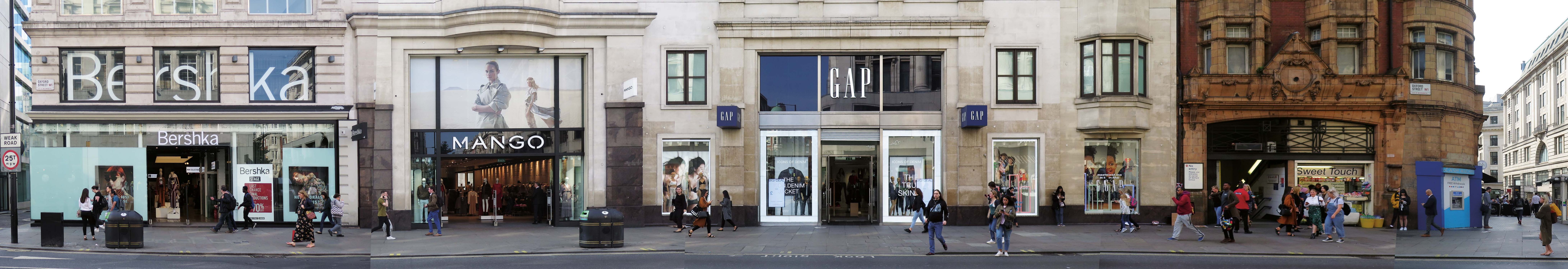 Panoramic photo of a strip of oxford street with GAP and Bershka