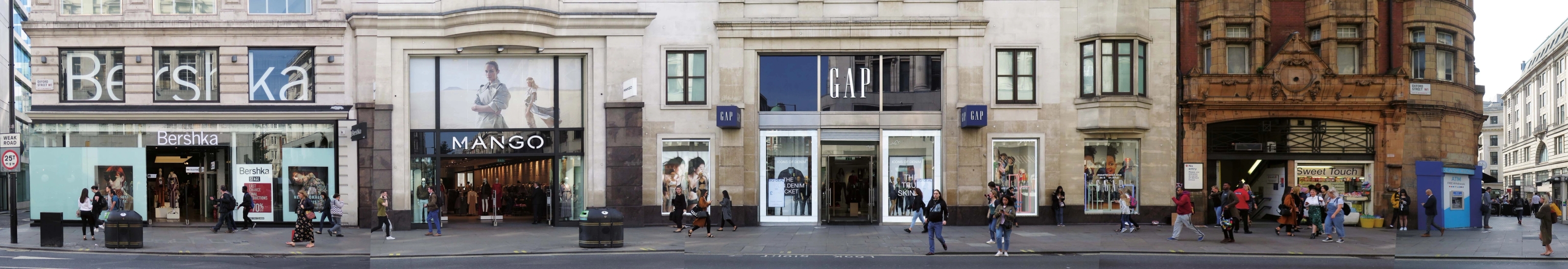 Panoramic photo of a strip of oxford street with GAP and Bershka