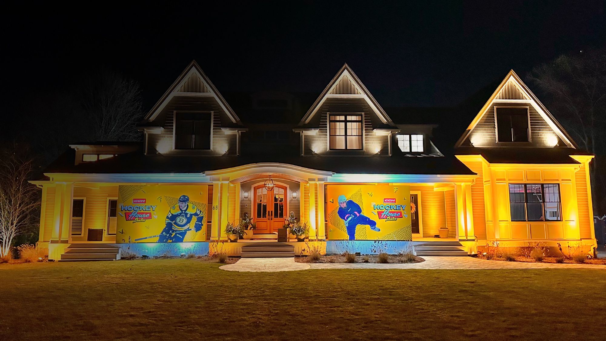 Exterior view of the CCM Hockey House Boston at night.