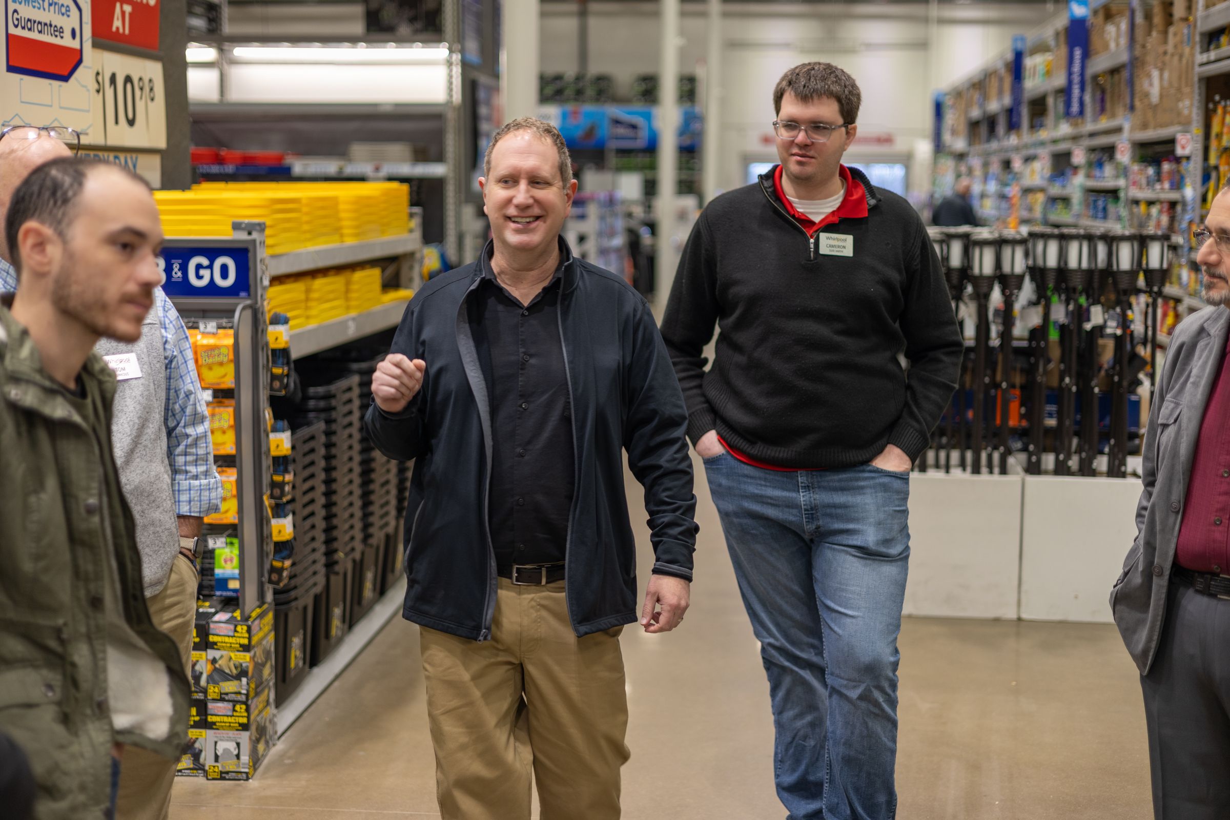 A Whirlpool retail associate helping a consumer.