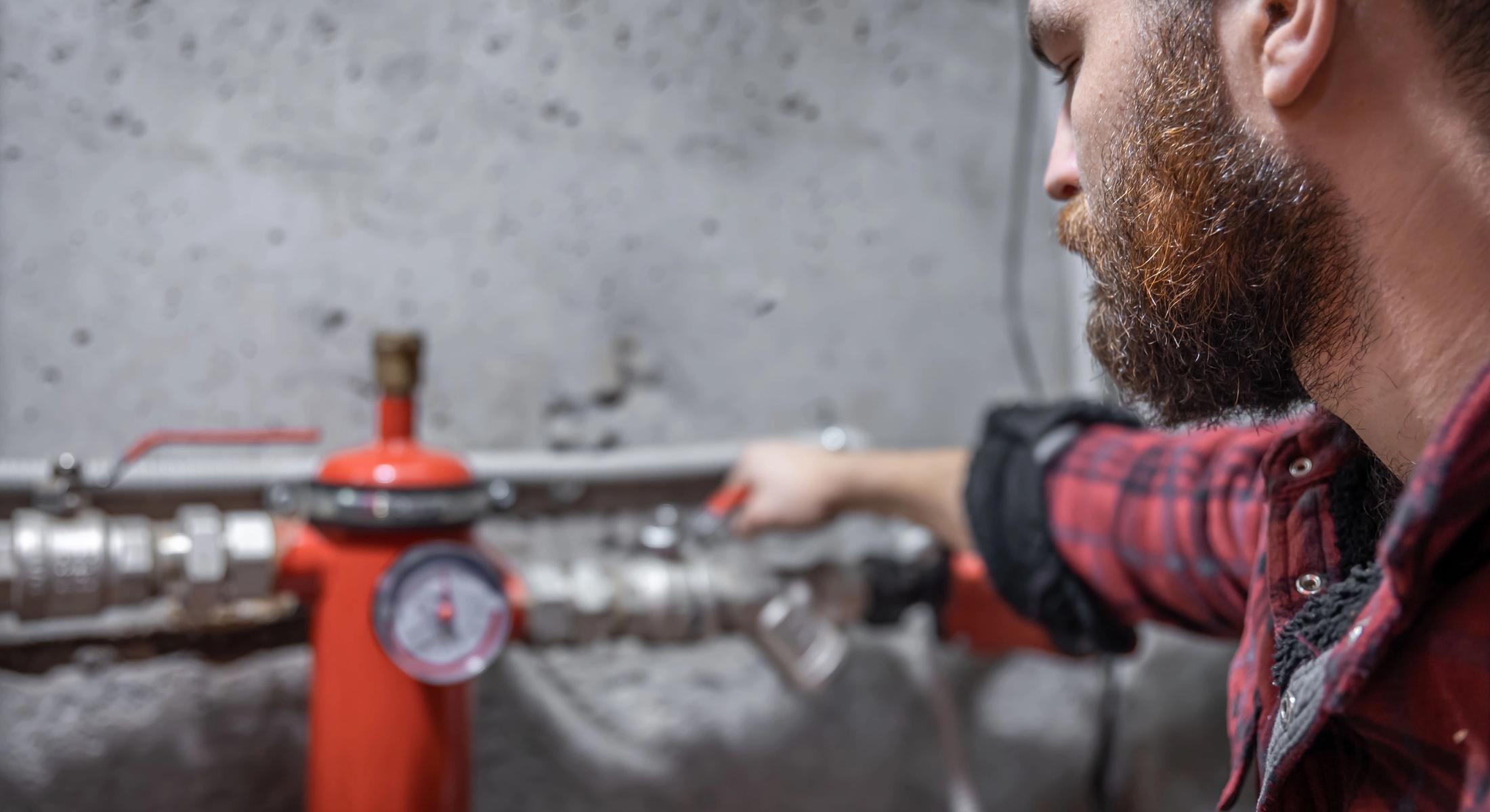 a man checking gas leak