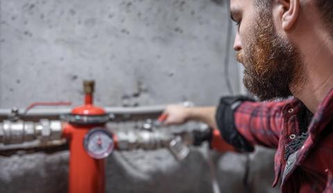 a man checking gas leak