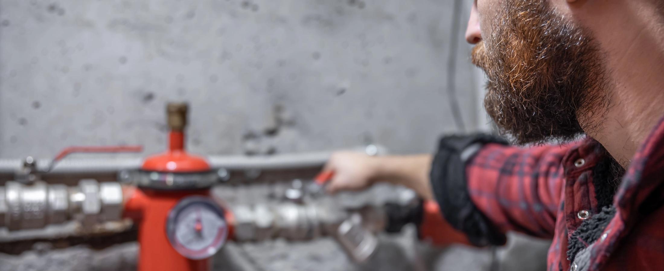 a man checking gas leak
