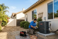 a man installing ac near California United States 