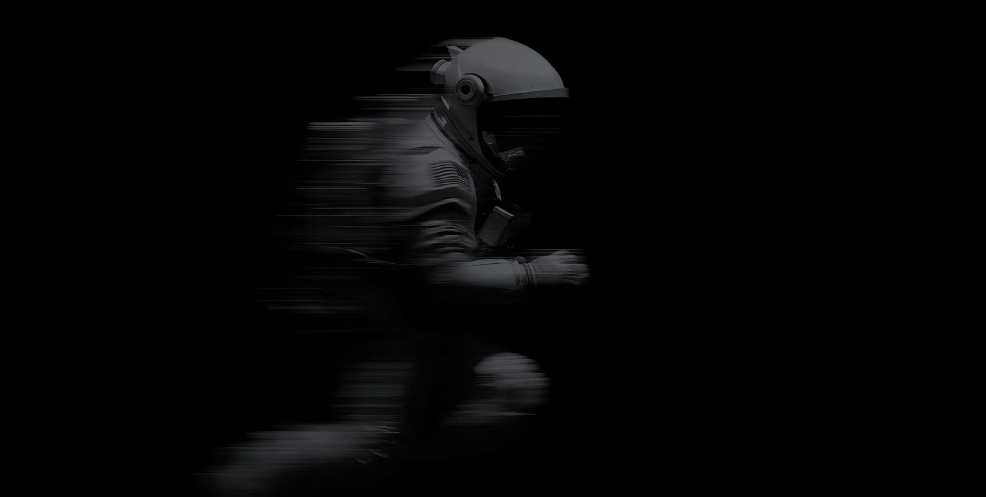 A figure in a helmet, blurred mid-stride