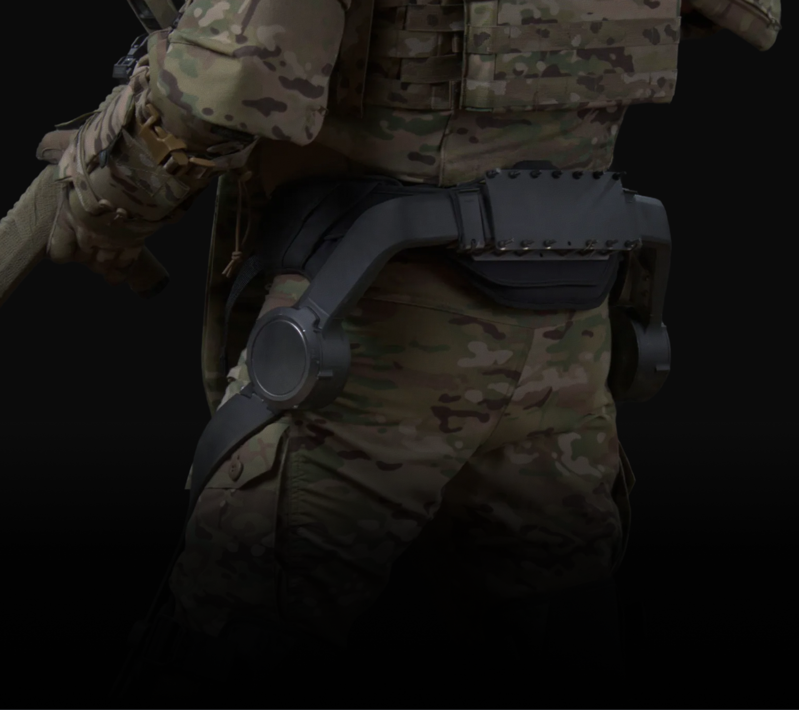 Edgerun exoskeleton anchored at the waist over a soldier's belt, plates and pack