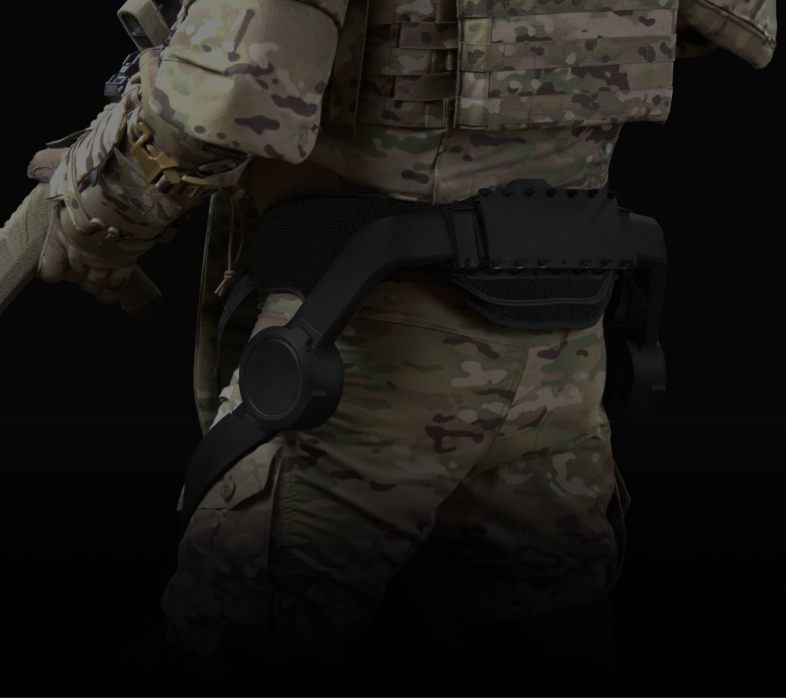 Edgerun exoskeleton anchored at the waist over a soldier's belt, plates and pack