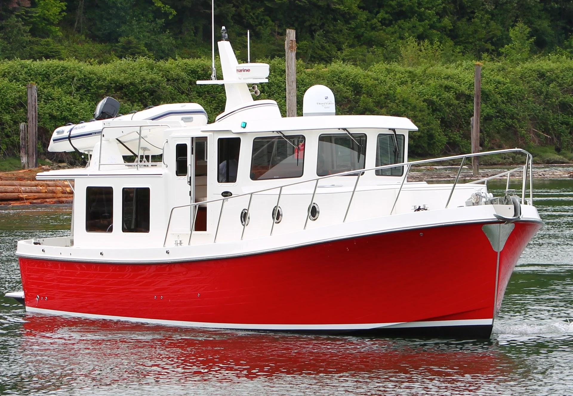 Red-hulled American Tug 395 underway