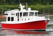Red-hulled American Tug 395 underway