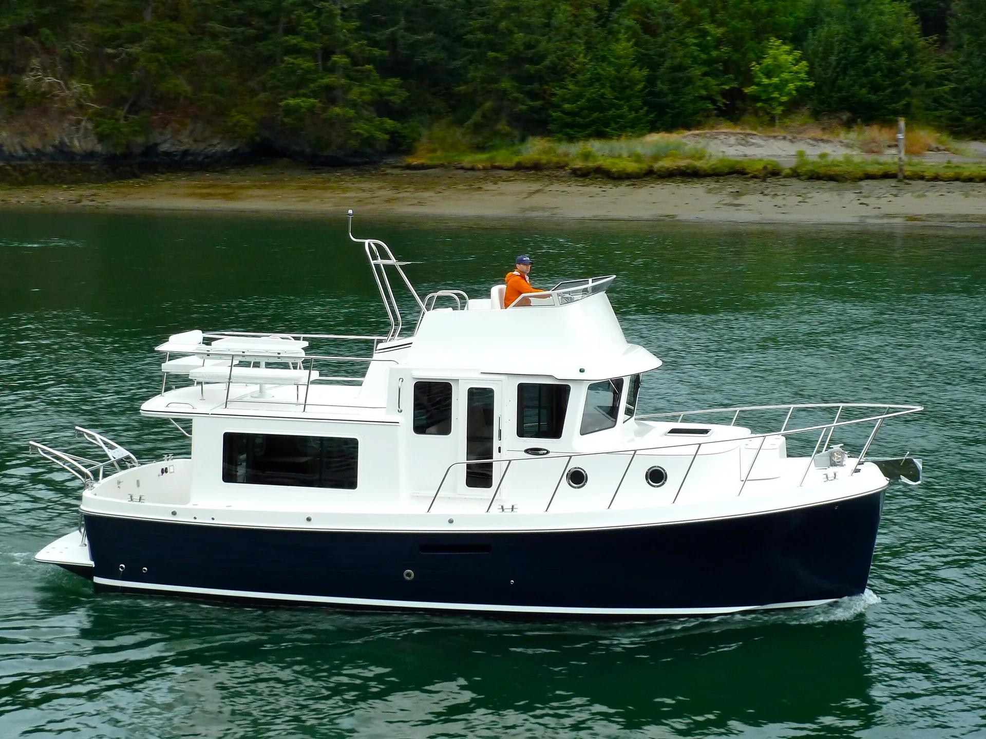 American Tug 365 with skipper on the flybridge