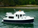 American Tug 365 with skipper on the flybridge