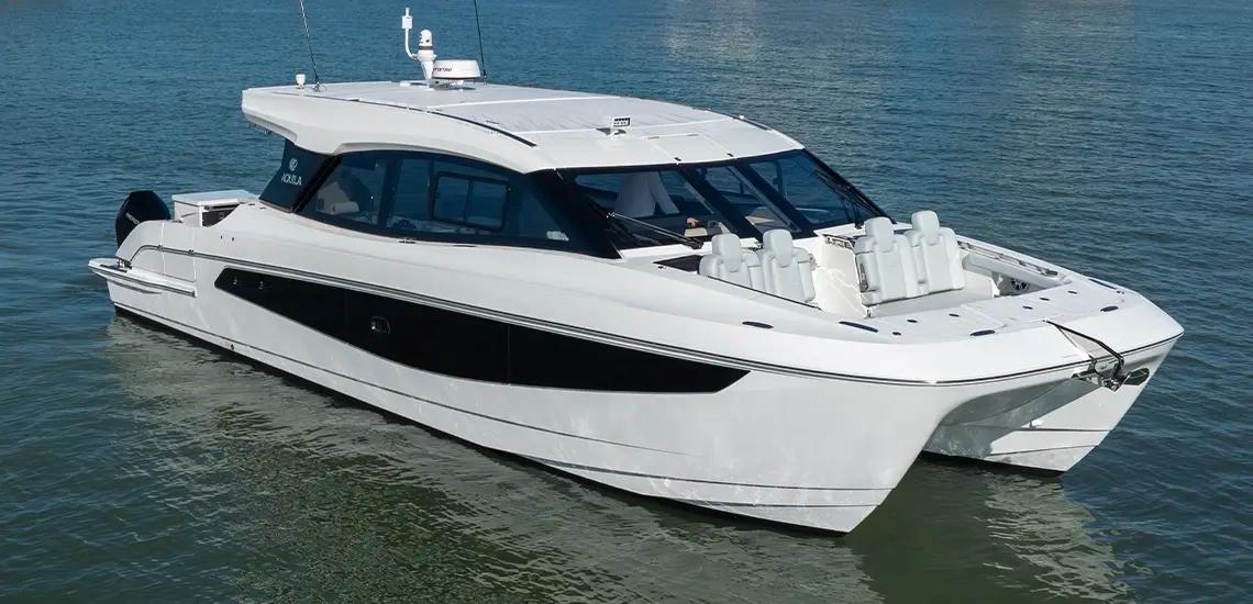 Aquila 42 Coupe from the bow quarter, showing twin hulls and forward seating