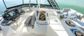 Aquila 42 Yacht flybridge with helm station and table