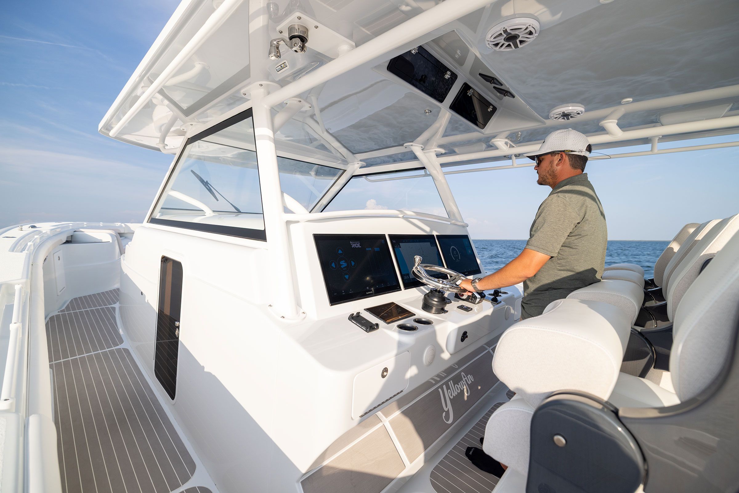 Helm console of the Yellowfin 54 Offshore with large displays and joystick controls