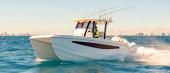 Aquila 28 Molokai at speed at sunset, starboard side view