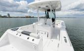 Bertram 28CC aft cockpit with mezzanine seating and twin Mercury outboards