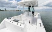 Bertram 28CC aft cockpit with mezzanine seating and twin Mercury outboards