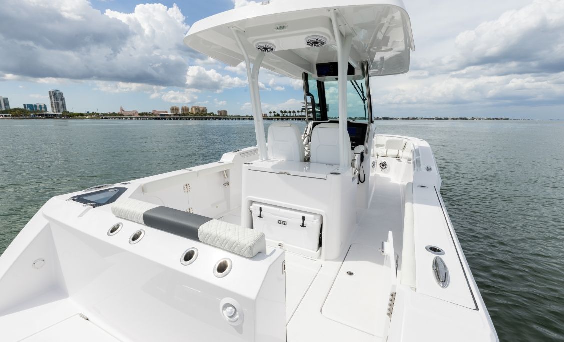 Bertram 28CC aft cockpit with mezzanine seating and twin Mercury outboards