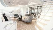 Westport 135 covered aft deck lounge with woven armchairs and stairway
