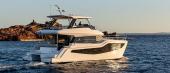 Aquila 46 Yacht cruising at sunset, port side view