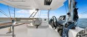 Aquila 50 Sail flybridge with central helm and U-shaped settee