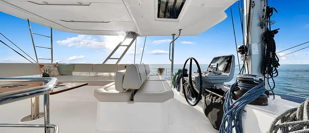 Aquila 50 Sail flybridge with central helm and U-shaped settee
