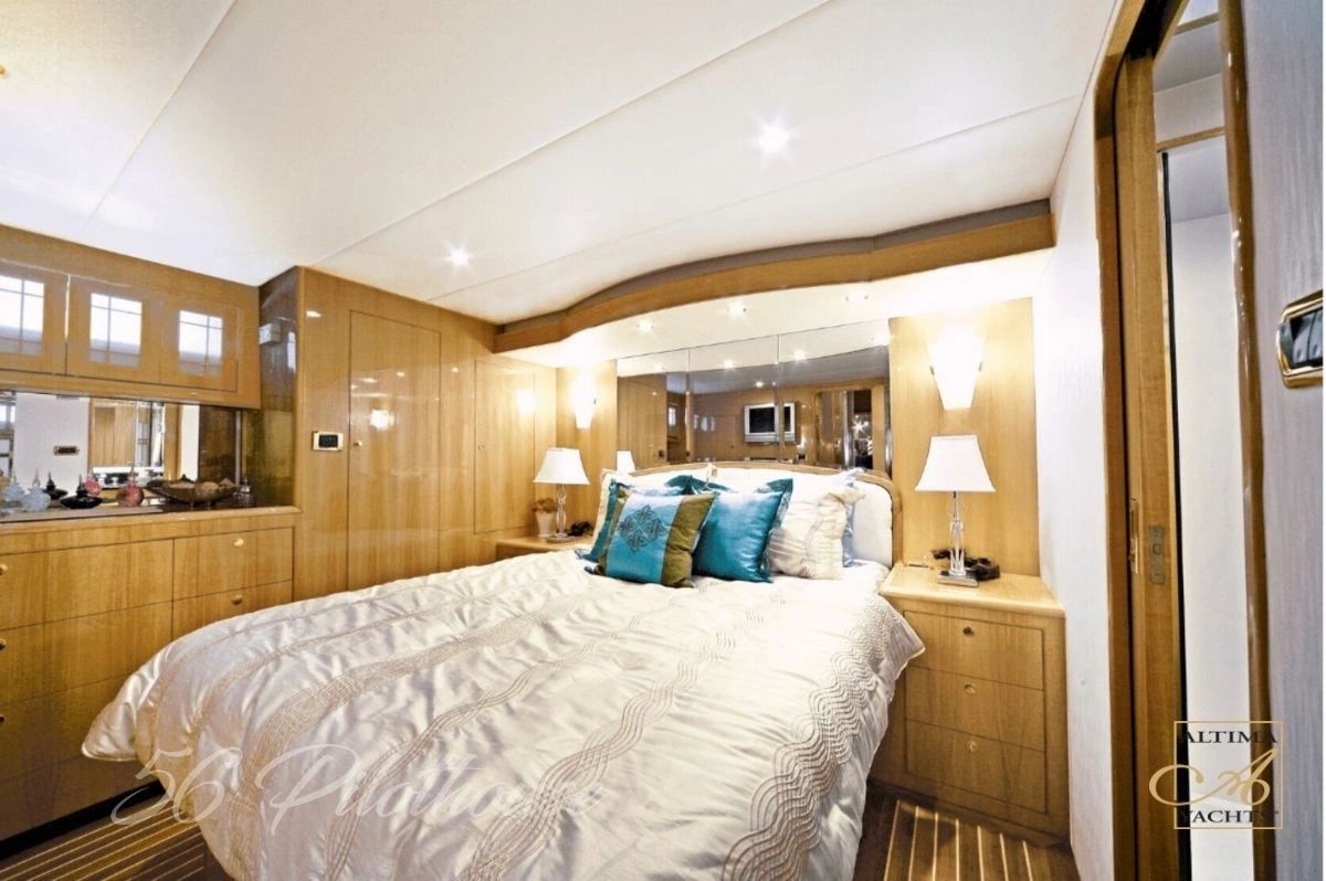 Altima 56 Pilothouse stateroom with queen bed and wood joinery