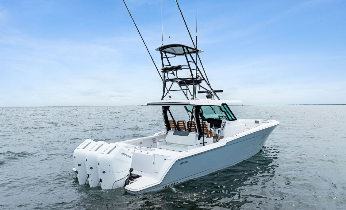 Bertram 39CC with tuna tower and outriggers at rest, stern quarter view