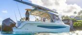 Aquila 28 Molokai Cuddy with extended hardtop and rod holders