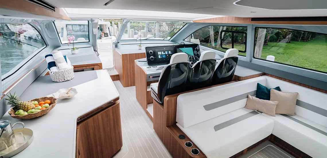 Aquila 46 Coupe salon with galley, L-shaped seating and helm seats