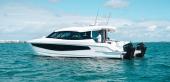 Aquila 42 Coupe at rest, port side profile with twin outboards