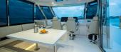 Aquila 54 Yacht enclosed flybridge with helm seats and dinette