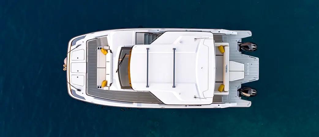 Aquila 35 Sport at rest, side profile with hardtop and twin outboards
