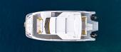 Aquila 35 Sport at rest, side profile with hardtop and twin outboards