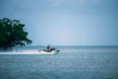 Kawasaki Jet Ski Ultra 160LX-S Angler in profile, riding into open water