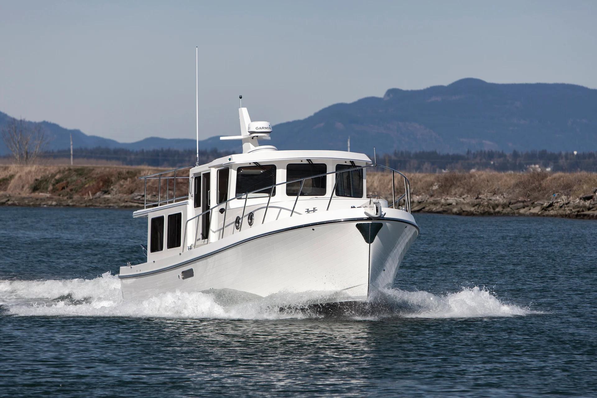White-hulled American Tug 362 running at speed