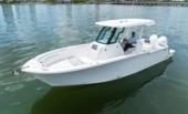 Bertram 28CC centre console with hardtop at rest, starboard bow quarter