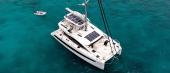 Aerial view of the Aquila 50 Sail at anchor in clear water