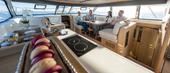 Aquila 42 Yacht galley with induction hob and salon dining area
