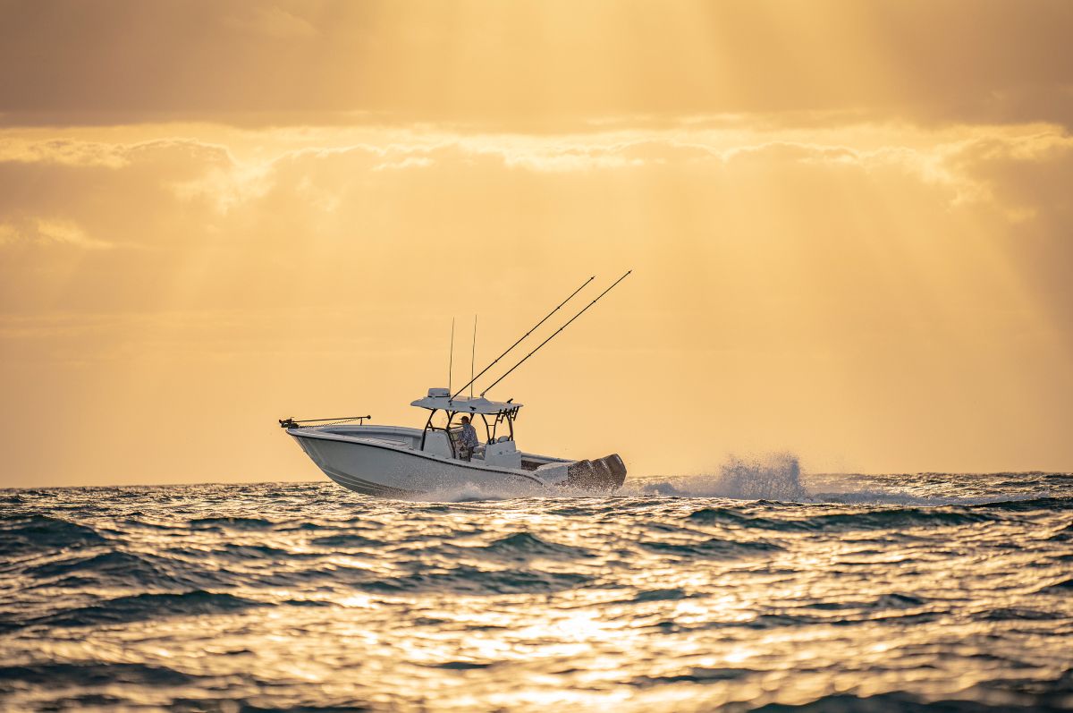 Yellowfin 34 Offshore running offshore under a golden sky