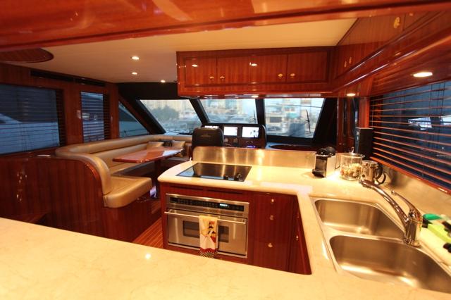 Altima 61 Pilothouse galley with stone counters and cooktop