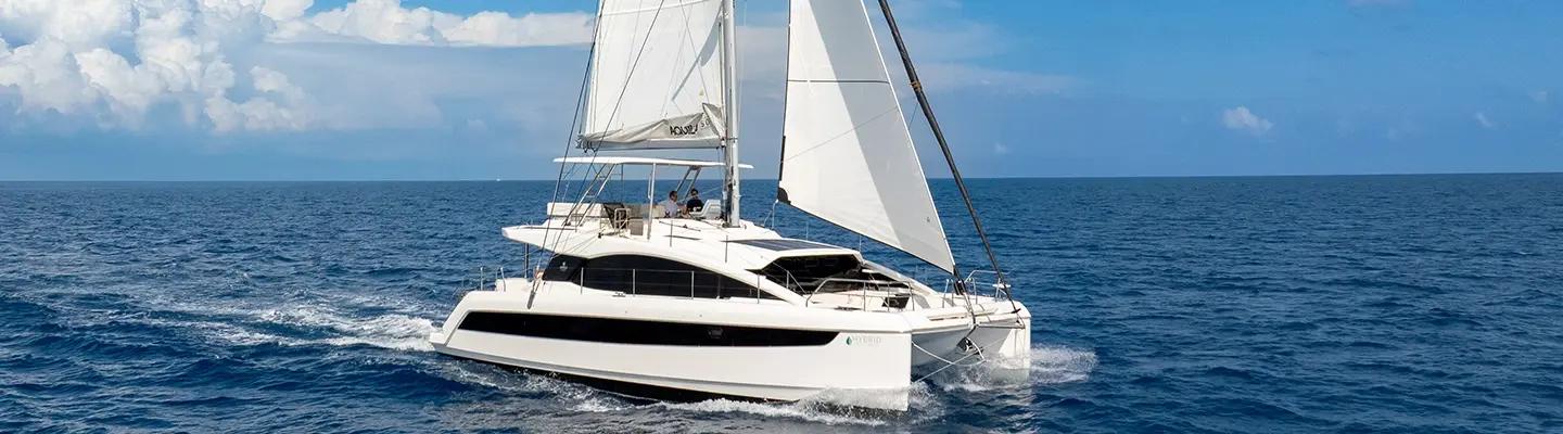 Aerial view of the Aquila 50 Sail sailing with full main and genoa