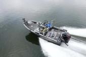 Aerial view of a Starcraft STX 2050 turning at speed with a white wake and two anglers on board