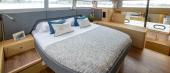 Aquila 54 Yacht full-beam master suite with king-size bed