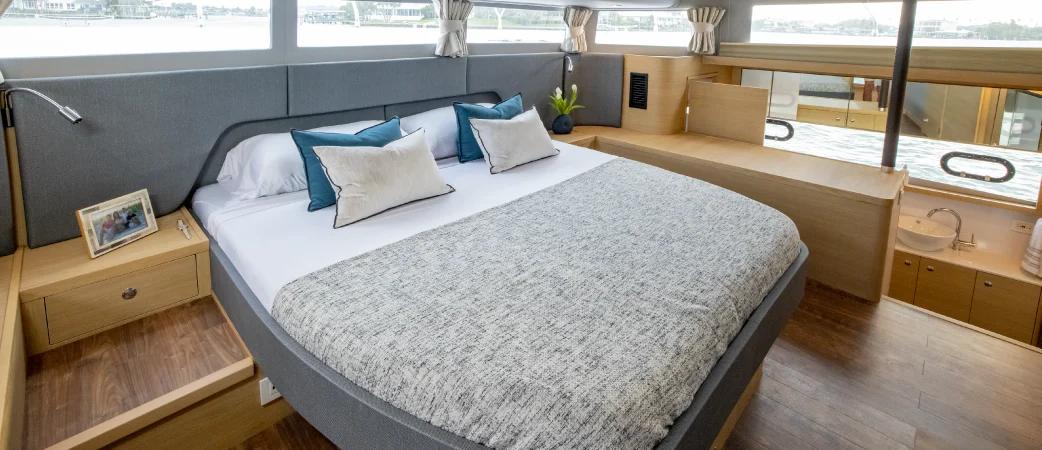 Aquila 54 Yacht full-beam master suite with king-size bed