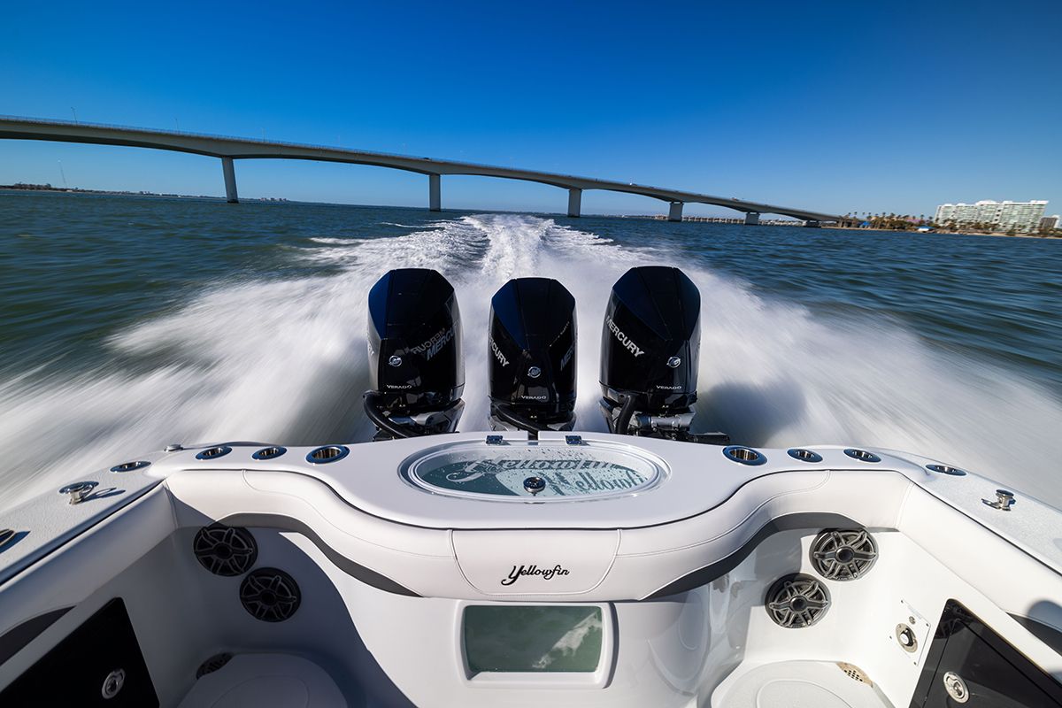 Stern of the Yellowfin 36 Offshore with three outboards at speed